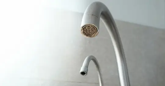 Hard water deposit on faucet